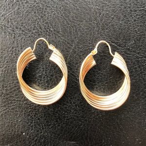 Tri-gold hoop earrings.